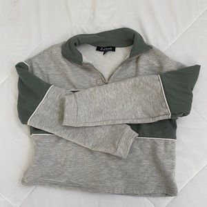 cropped grey and green striped quarter zip sweater